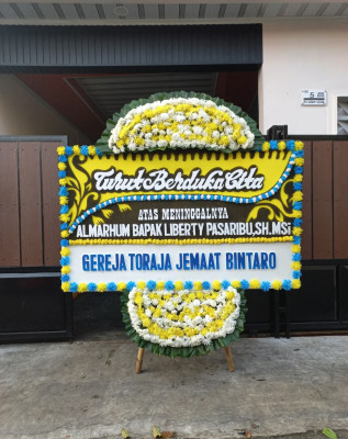Papan Bunga Duka di Rawamerta